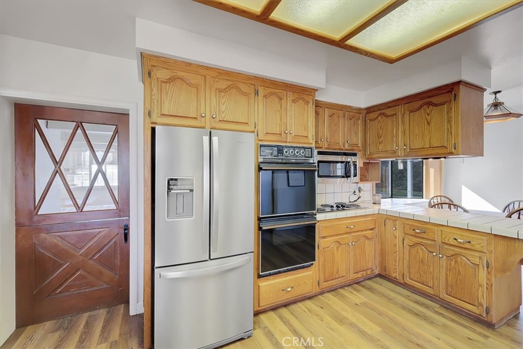 1255 Richvale Highway Richvale, CA 95974 - Photo 11 of 49 a kitchen with stainless steel appliances a refrigerator sink and cabinets