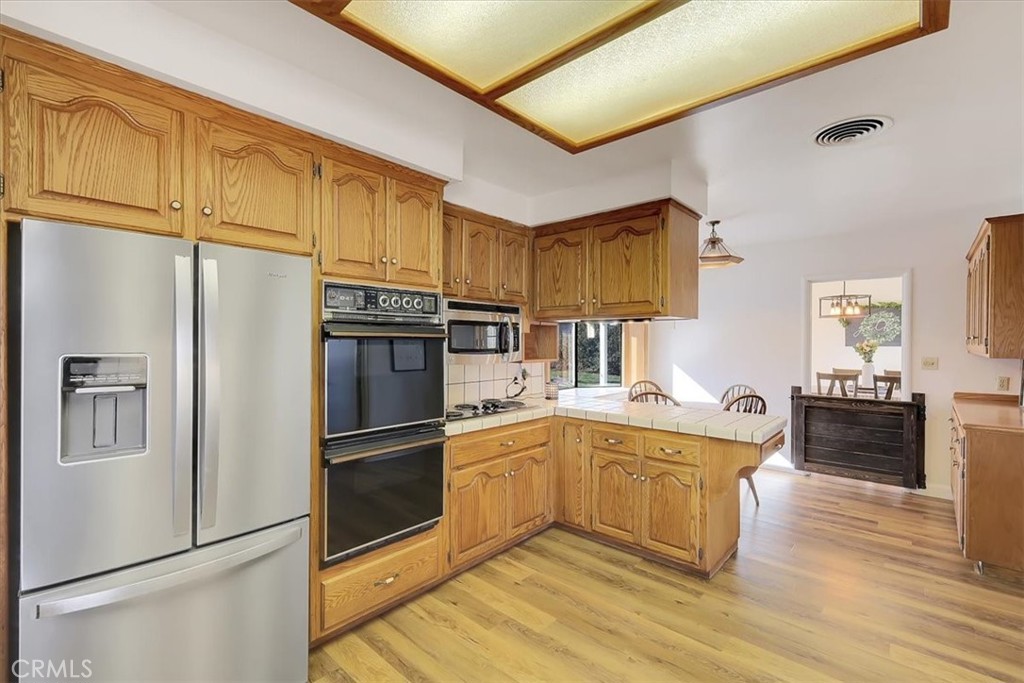 1255 Richvale Highway Richvale, CA 95974 - Photo 12 of 49 a kitchen with stainless steel appliances a refrigerator and a stove top oven