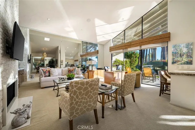 a living room with fireplace furniture and a flat screen tv