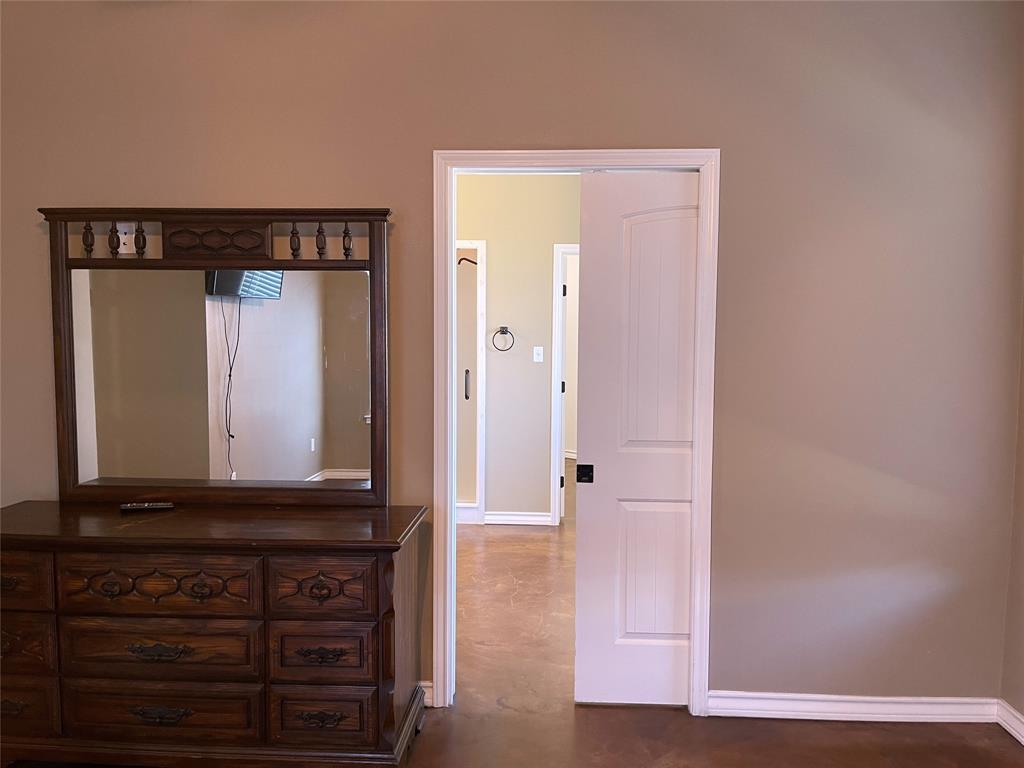 207 Northline Road Teague, TX 75860 - Photo 22 of 40 Pocket door access to Primary Bathroom