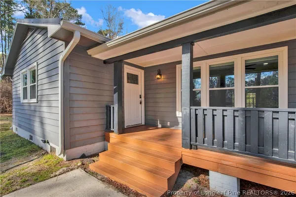 a view of a two chairs in the balcony