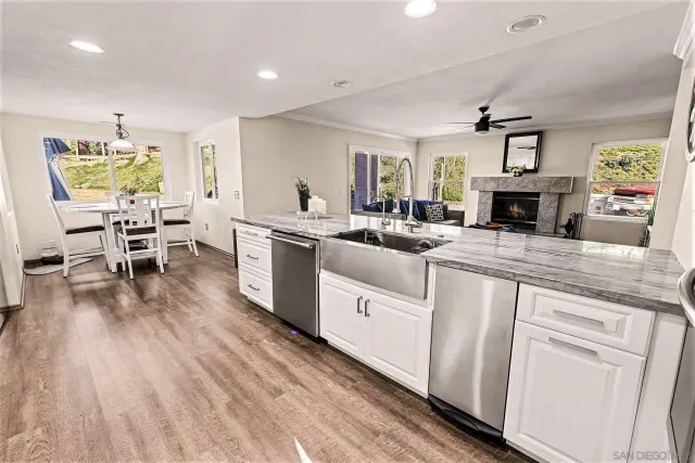 a kitchen with sink stove and refrigerator