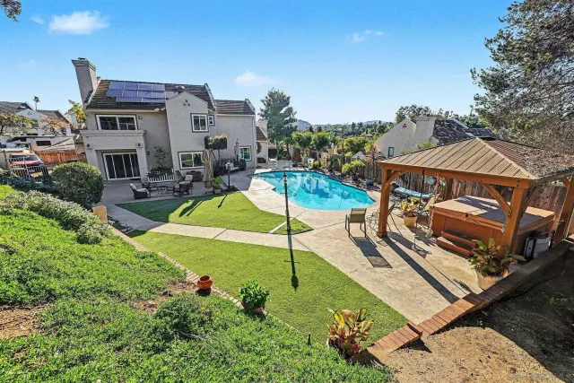an aerial view of a house with a garden