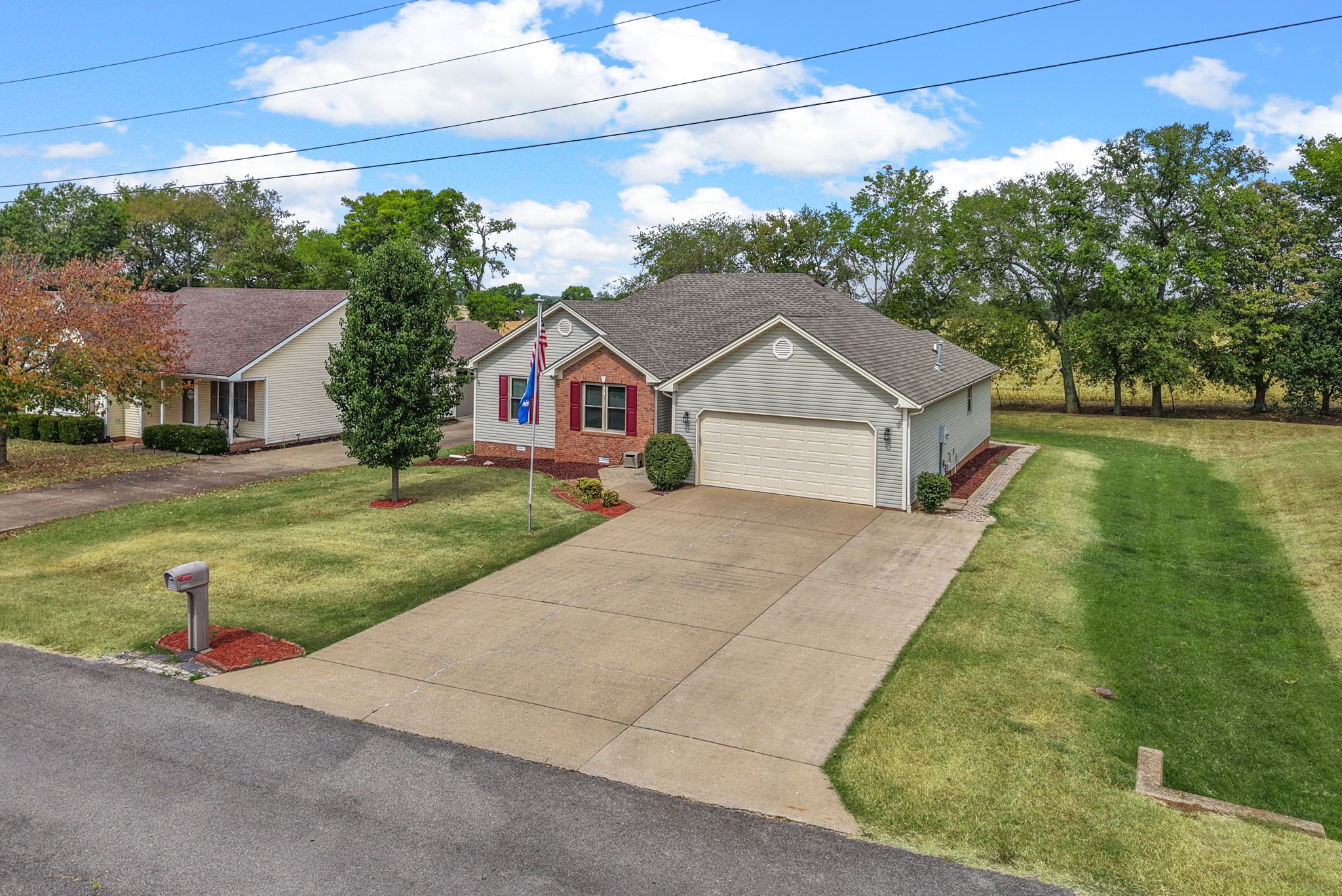 1230 Bark Ridge Circle Hopkinsville, KY 42240 - Photo 34 of 38 a front view of a house with a yard