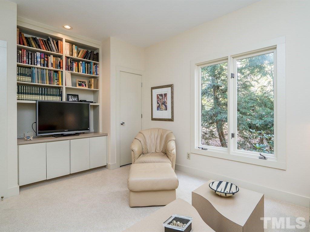 10000 Grafton Road Raleigh, NC 27615 - Photo 12 of 25 First floor guest bedroom with built in cabinetry, shelving and 2 closets. Room opens to full bathroom.