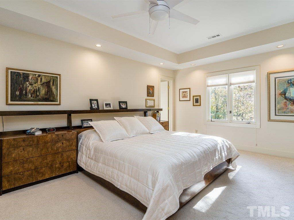10000 Grafton Road Raleigh, NC 27615 - Photo 15 of 25 Large master bedroom with trey ceiing, new ceiling fan with light, recessed lighting, (on dimmers), double windows and new neutral pleated shades.