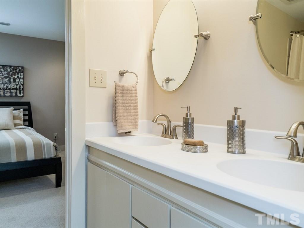 10000 Grafton Road Raleigh, NC 27615 - Photo 20 of 25 New counter and sinks, raised vanity, new mirrors, hardware and lighting.