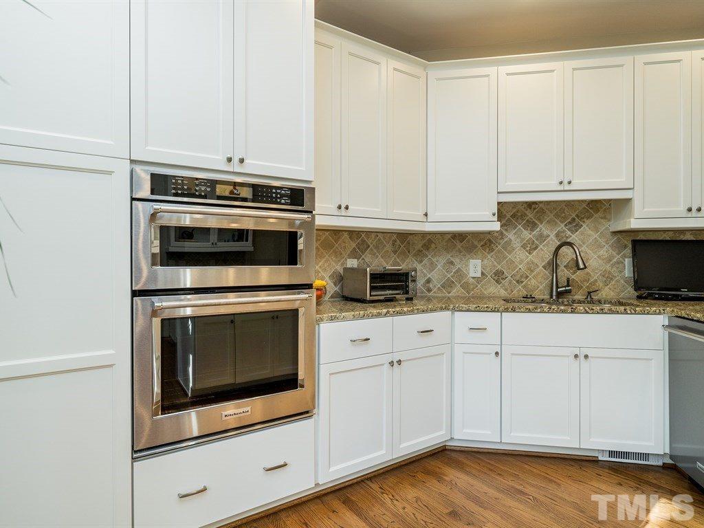 10000 Grafton Road Raleigh, NC 27615 - Photo 7 of 25 The remodeled kitchen offers tall cabinets, with 2 built in cabinet pantries, a built in wall pantry and a broom closet. Spread out your dishes, serving pieces and groceries in this large kitchen.