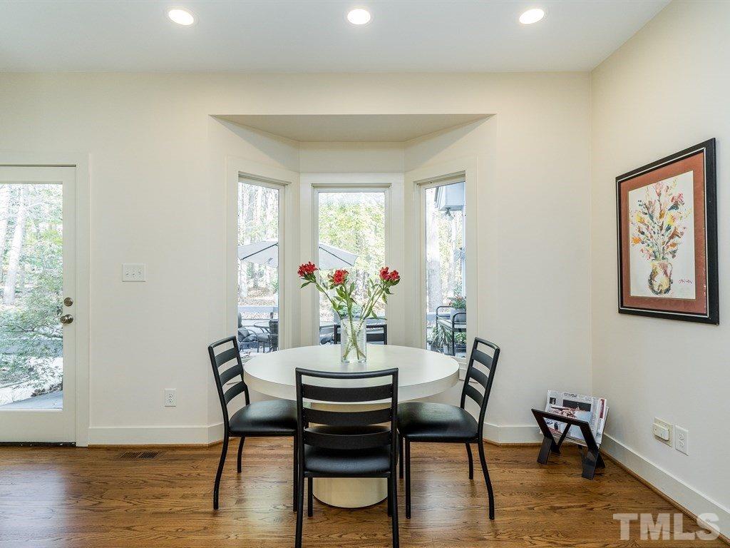 10000 Grafton Road Raleigh, NC 27615 - Photo 8 of 25 Spacious eating area with recessed lighting & bay window. Enjoy the view of the back yard when relaxing over a nice dinner. (Sellers have even been treated to a view of baby foxes playing on their deck!)