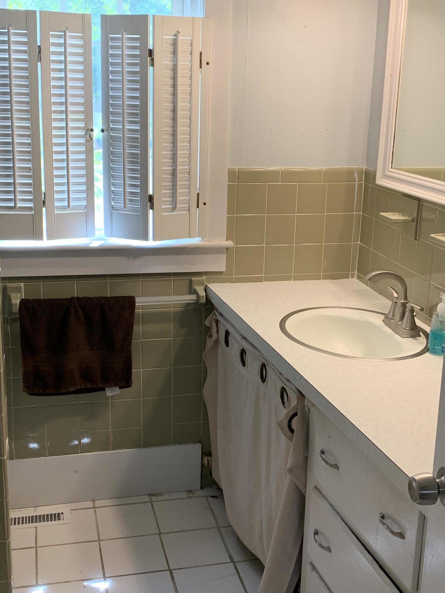 62 Kelley Road Hyannis, MA 02601 - Photo 8 of 17 a bathroom with a sink a mirror and a bathtub