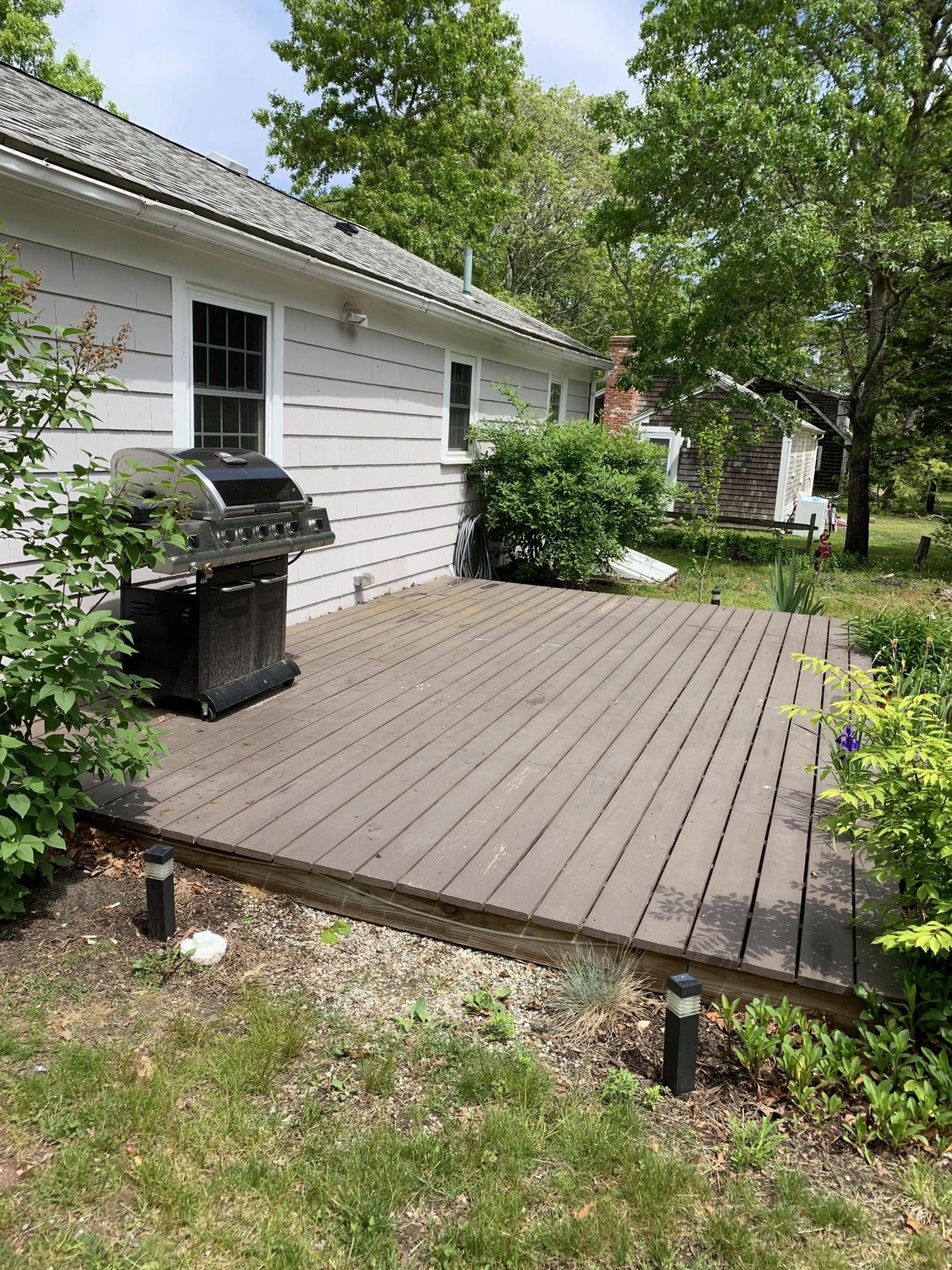62 Kelley Road Hyannis, MA 02601 - Photo 10 of 17 a view of a backyard with plants and large tree