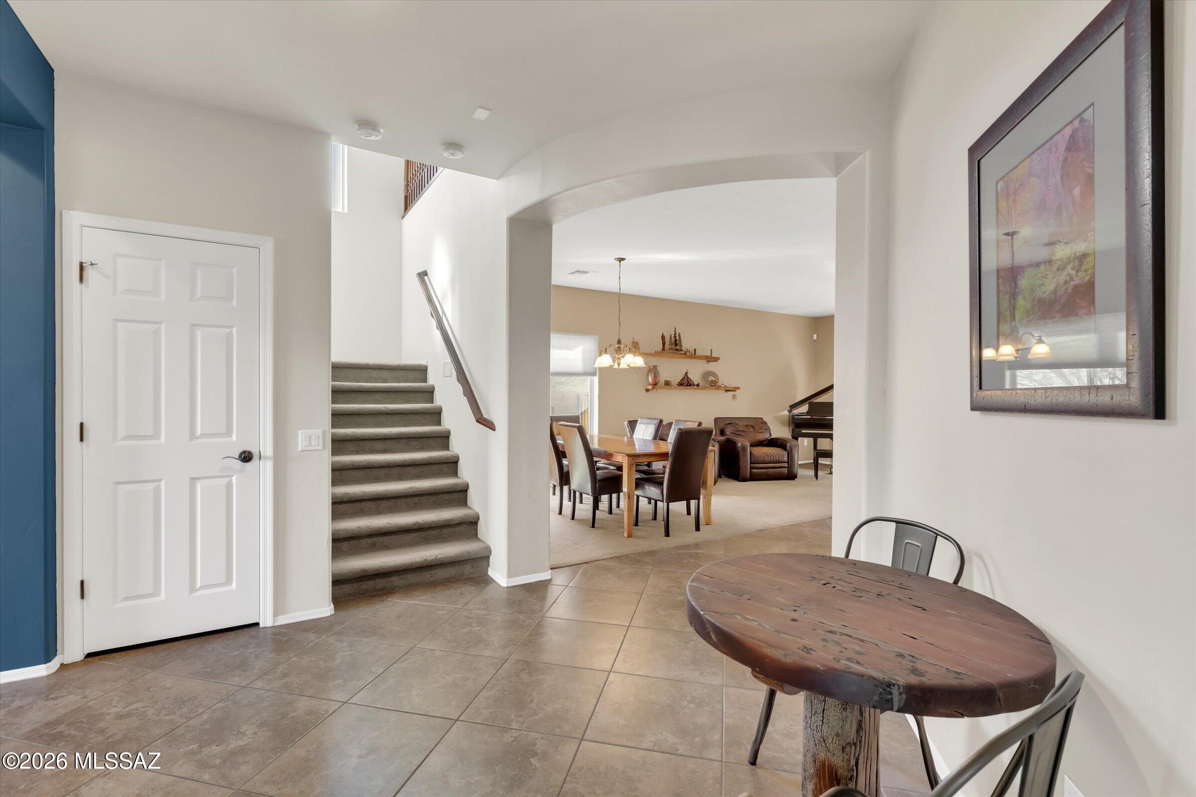 6095 South Jakemp Trail Tucson, AZ 85747 - Photo 14 of 52 a dining room with furniture and entryway