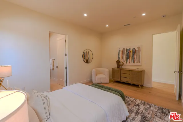 a bedroom with a bed and furniture