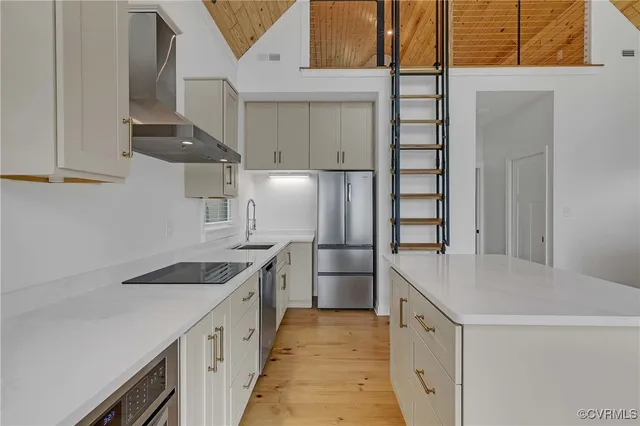 a kitchen with a sink a stove and refrigerator