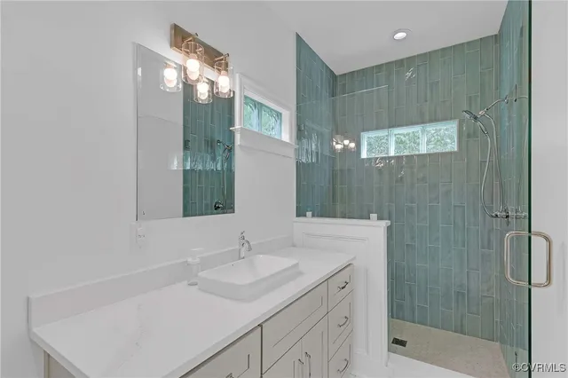 a bathroom with a granite countertop sink a toilet and a mirror
