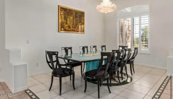 a view of a dining room with furniture and window