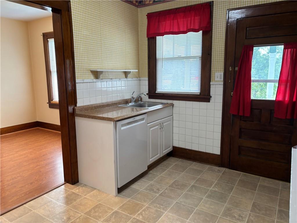 264 Hopwood Fairchance Road Uniontown, PA 15401 - Photo 3 of 19 a room with a stove a sink and a window