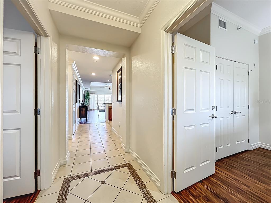 7660 Whisper Way, Unit 402 Reunion, FL 34747 - Photo 2 of 65 a view of a hallway with a furniture