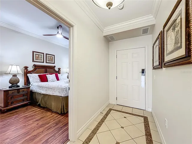 a bedroom with a bed and a mirror