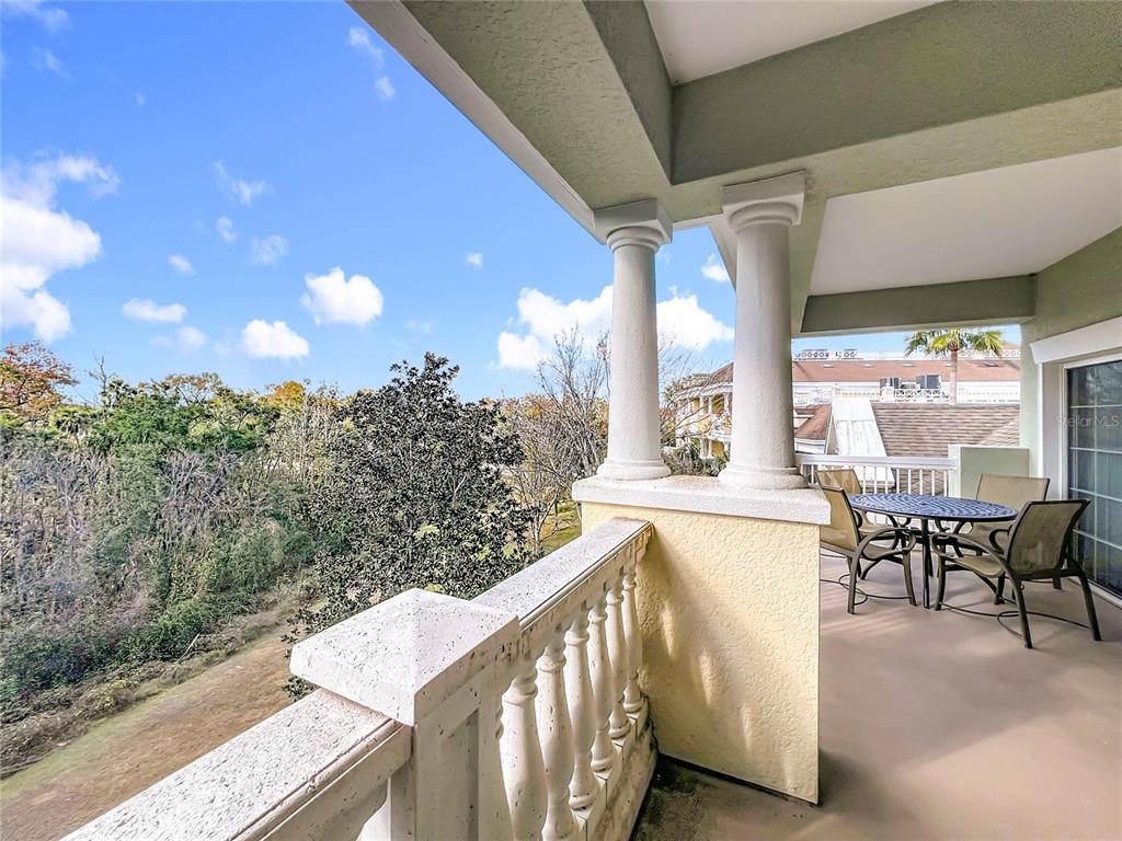 7660 Whisper Way, Unit 402 Reunion, FL 34747 - Photo 45 of 65 a view of a balcony with chairs