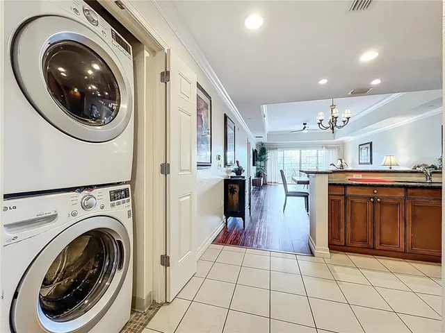 a kitchen with stainless steel appliances granite countertop a refrigerator sink and microwave