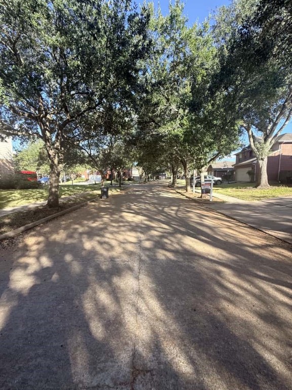 4410 Innsbrook Place Sugar Land, TX 77479 - Photo 2 of 15 a view of a tree in the middle of a yard