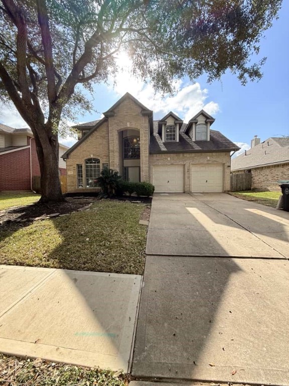 4410 Innsbrook Place Sugar Land, TX 77479 - Photo 3 of 15 a front view of a house with garden