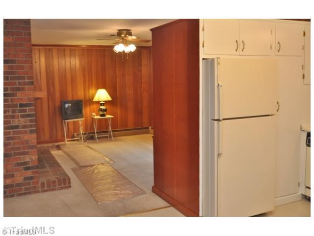 421 Kyle Road Winston-Salem, NC 27104 - Photo 6 of 16 Den/Family/Great Room. The kitchen is adjacent to the charming den with fireplace