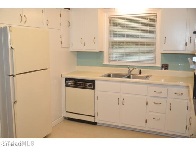 421 Kyle Road Winston-Salem, NC 27104 - Photo 10 of 16 Kitchen. Fresh white cabinets provide a ton of storage in the kitchen