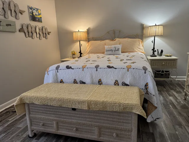 a bedroom with a bed and a lamp