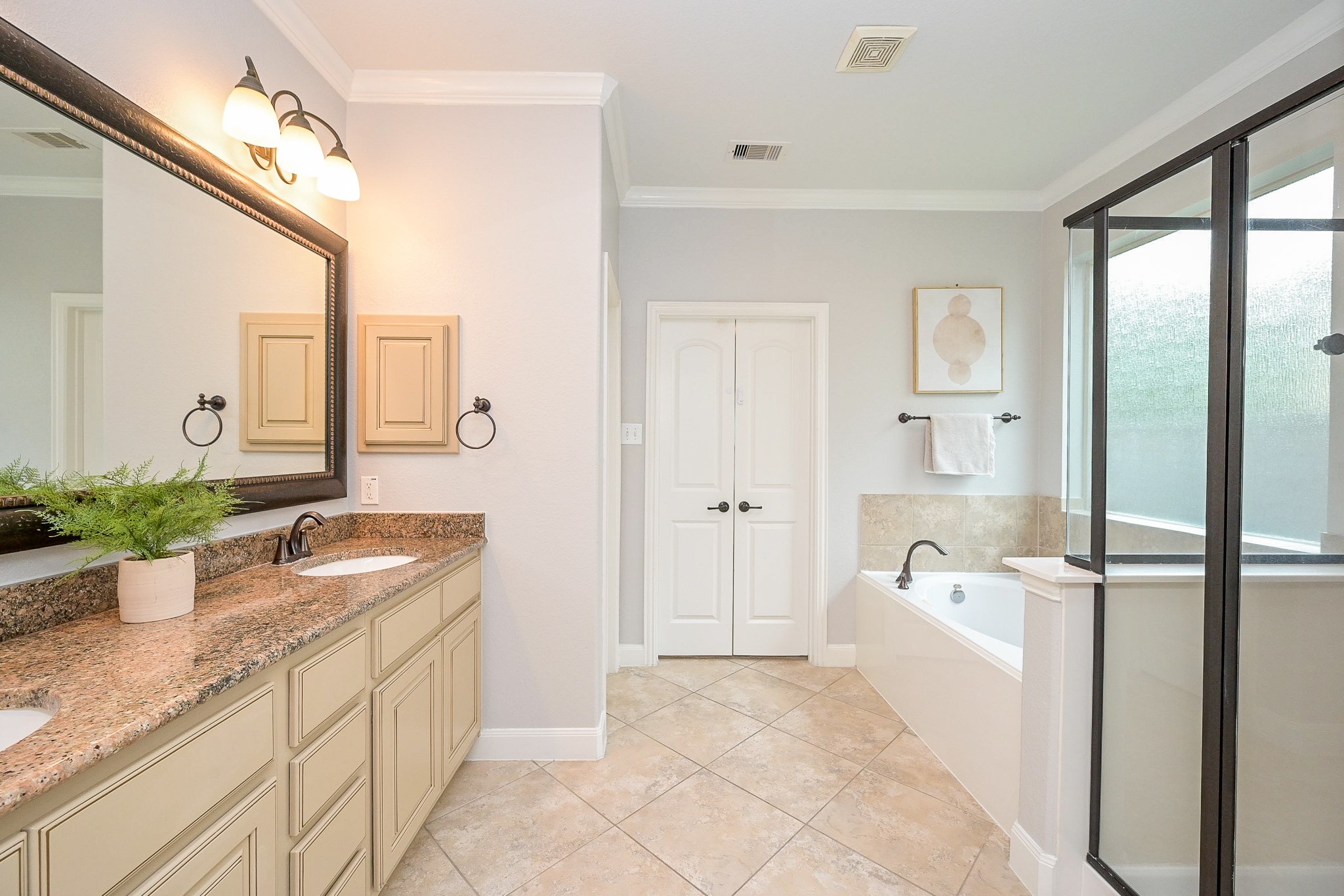 11 South Victoriana Circle Spring, TX 77389 - Photo 23 of 38 a spacious bathroom with a granite countertop tub sink and mirror