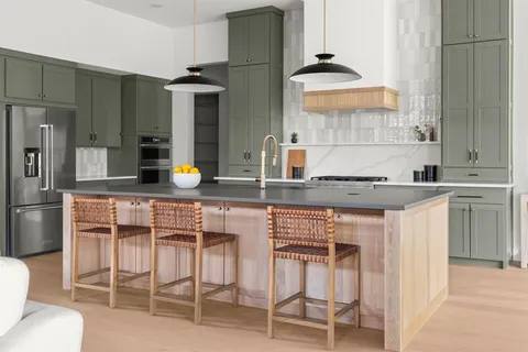a kitchen with a sink cabinets and stainless steel appliances