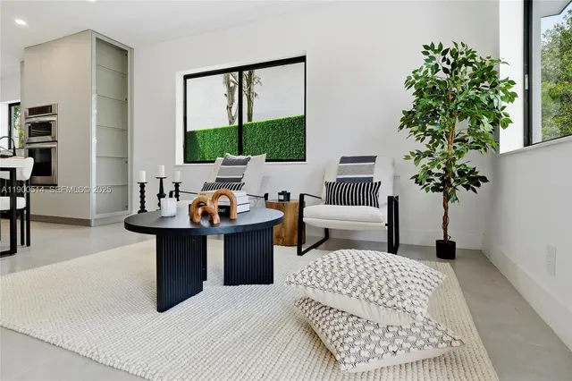 a bed room with a bed and a potted plant