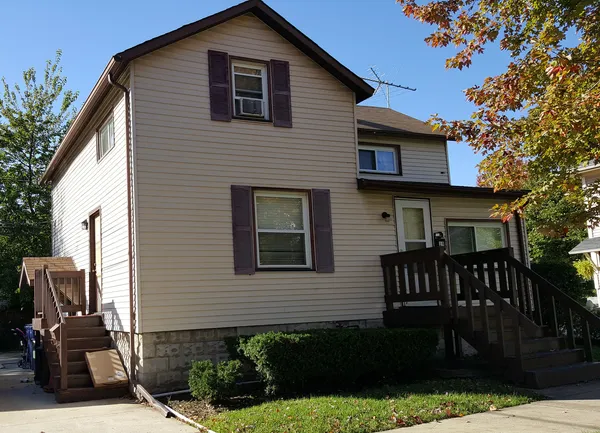 a front view of a house with garage