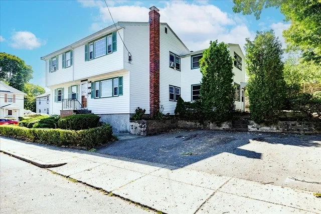 a view of a front of house with a street