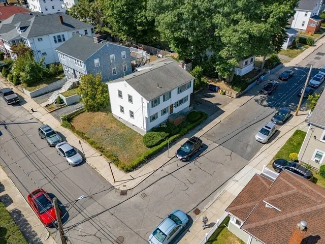 an aerial view of a house with a garden