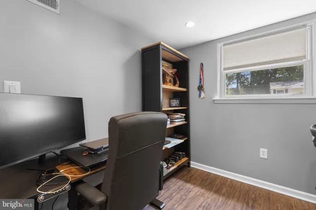 a workspace with furniture and lamp