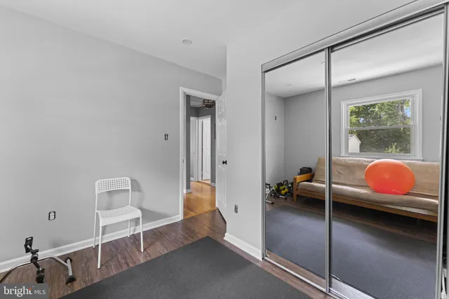 a bedroom with furniture and window