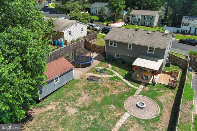 an aerial view of a house with swimming pool
