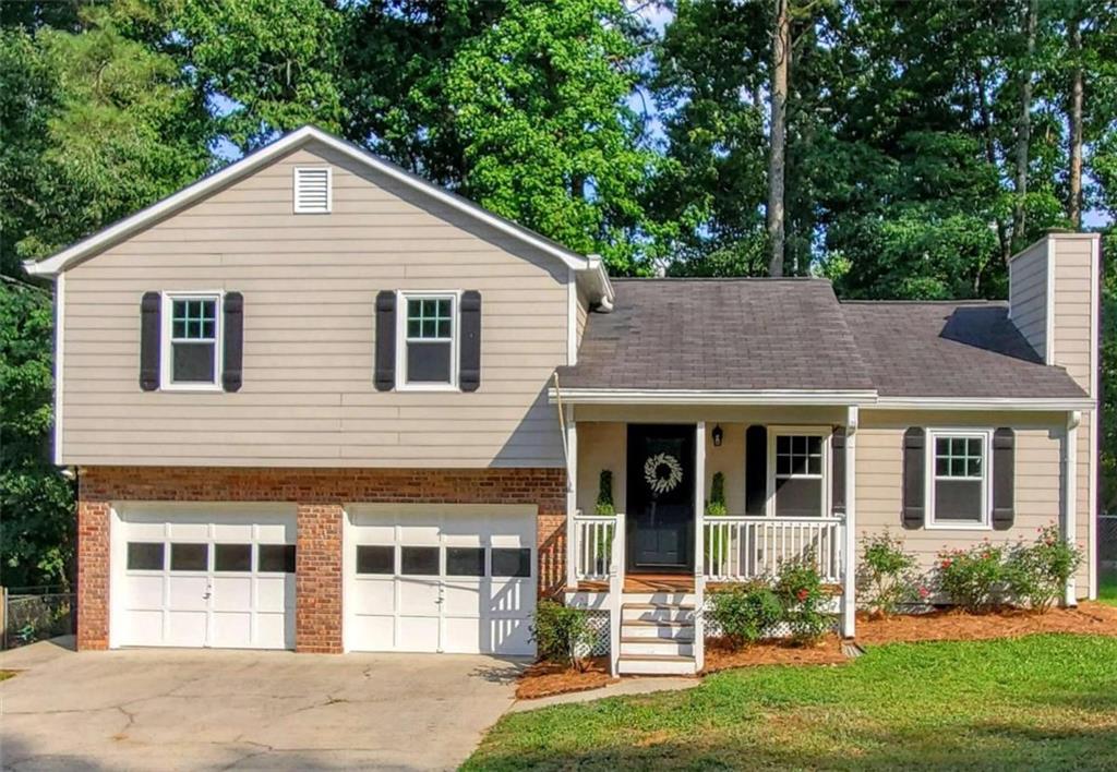 1075 Rackley Way Kennesaw, GA 30144 - Photo 1 of 1 a view of a house with a yard