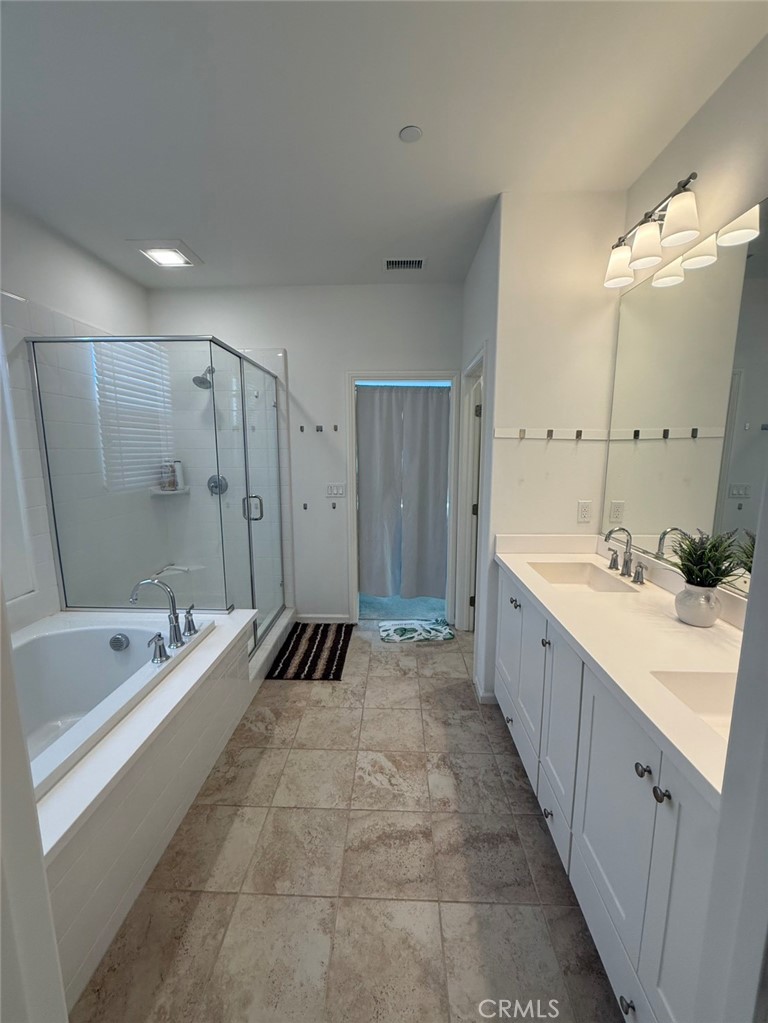 146 Working Irvine, CA 92602 - Photo 11 of 17 a spacious bathroom with a bathtub shower sink and mirror