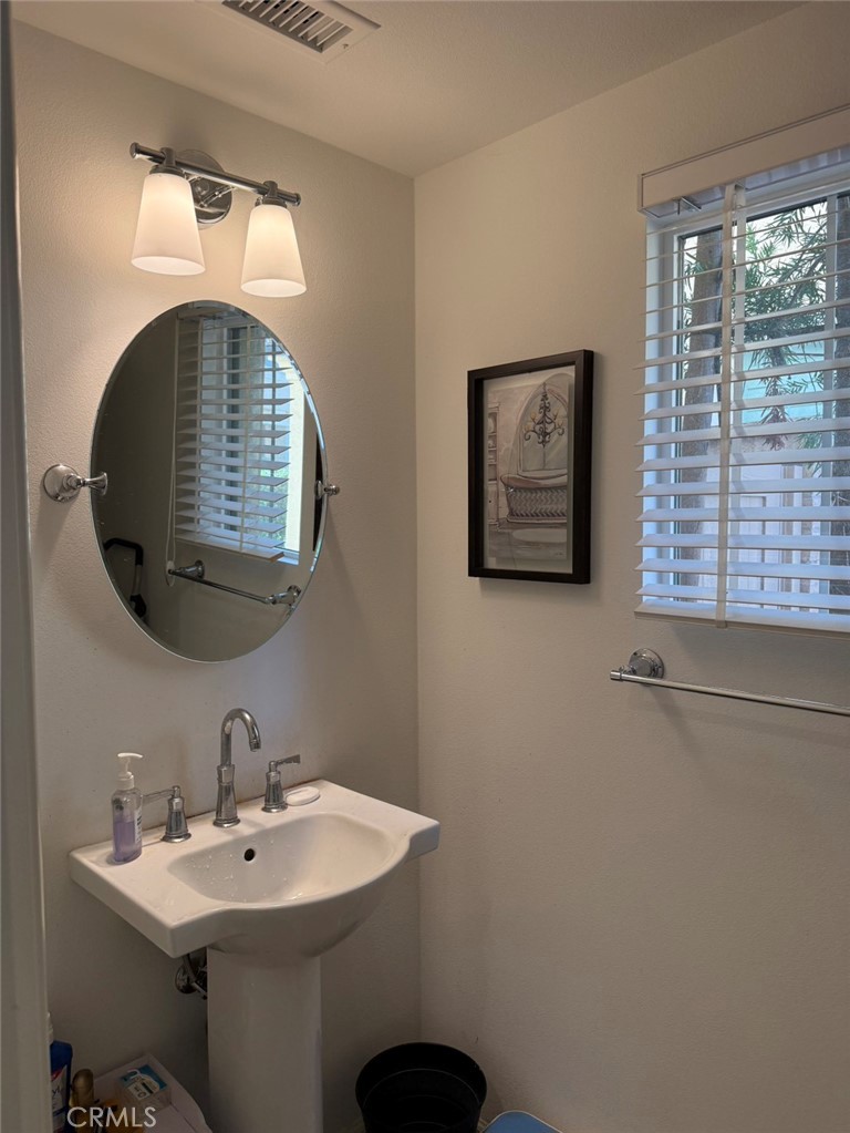 146 Working Irvine, CA 92602 - Photo 7 of 17 a bathroom with a sink and a mirror