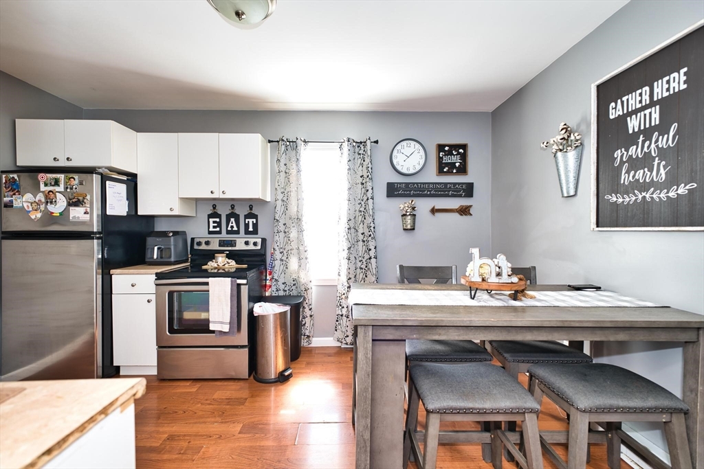 232 Alden Street Fall River, MA 02723 - Photo 27 of 34 a kitchen with a sink cabinets and stainless steel appliances