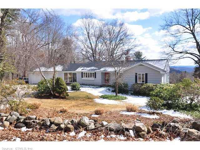 111 Morgan Road Canton, CT 06019 - Photo 1 of 1 a front view of a house with a yard covered with snow and trees