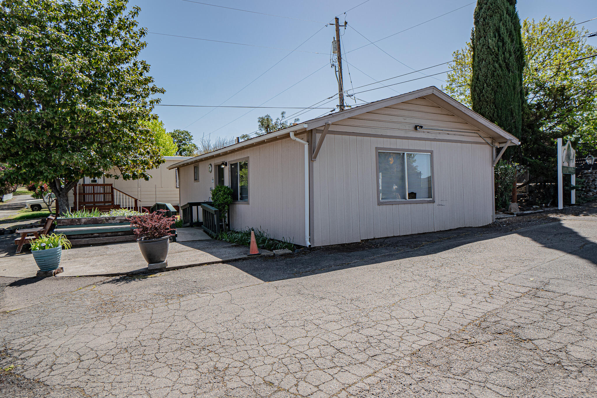 421 Stevens Road, Unit 26 Eagle Point, OR 97524 - Photo 22 of 23 a view of a house with a yard