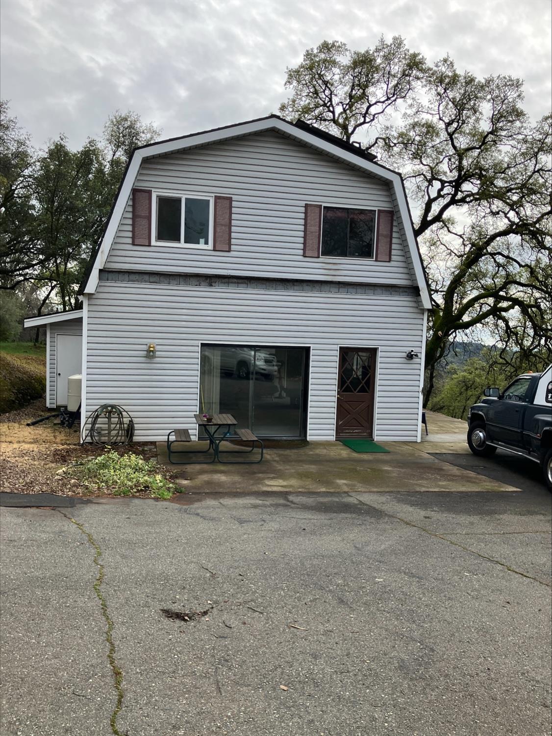 a view of a house with a yard and garage