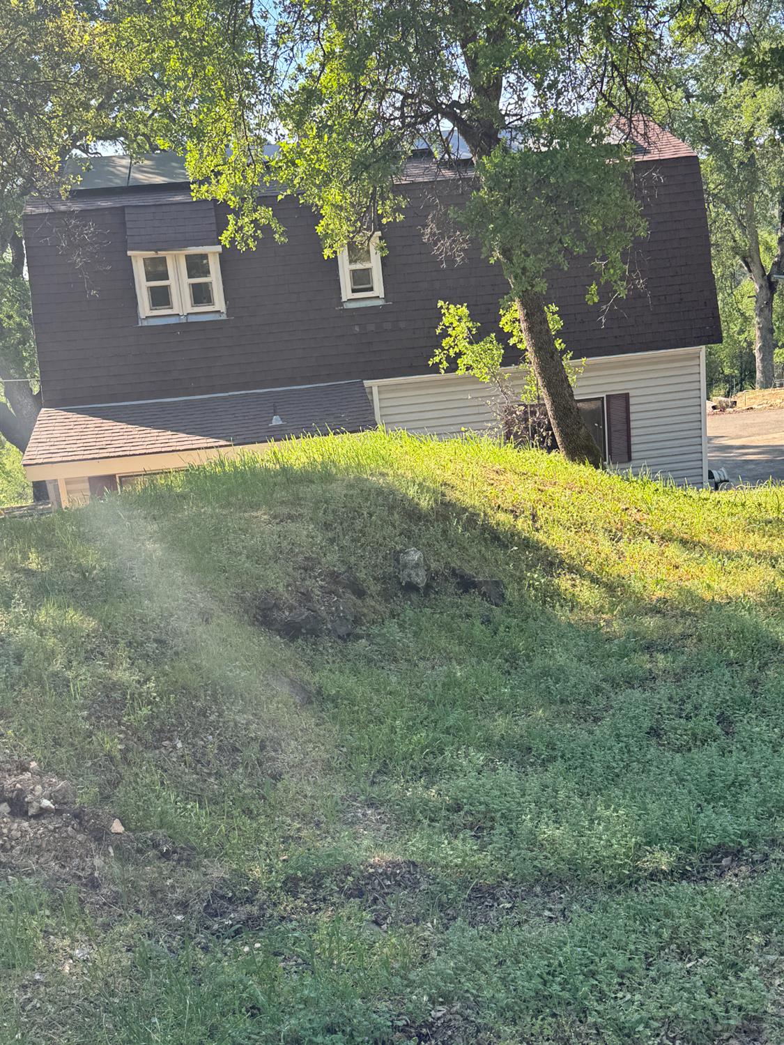670 Stone House Road Auburn, CA 95603 - Photo 12 of 46 a view of a yard with a house