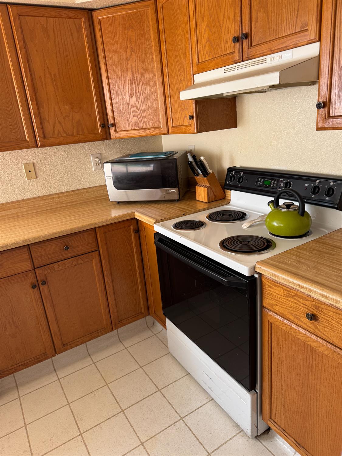 670 Stone House Road Auburn, CA 95603 - Photo 13 of 46 a kitchen with a sink and cabinets