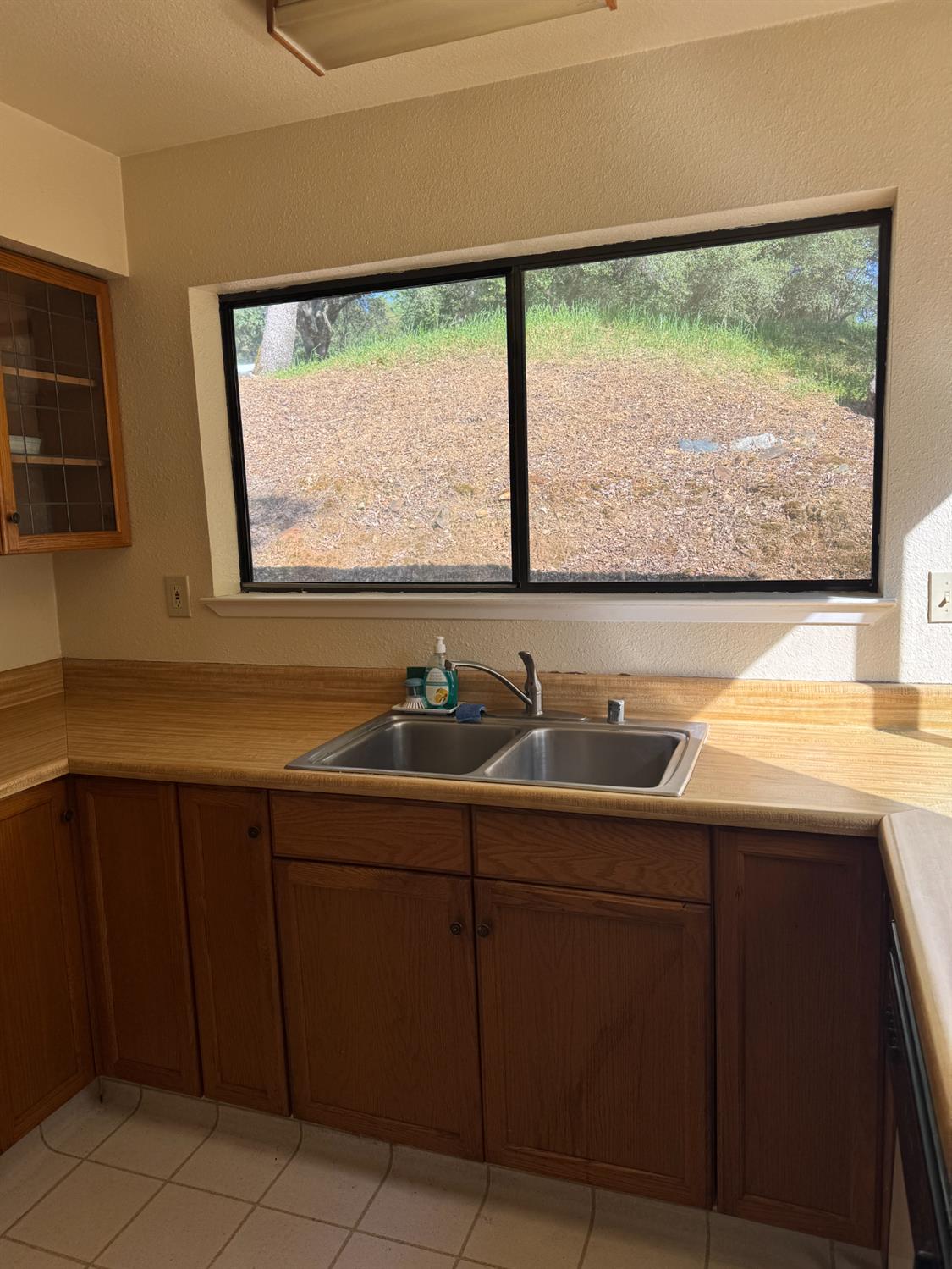 670 Stone House Road Auburn, CA 95603 - Photo 15 of 46 a kitchen with a sink and large window