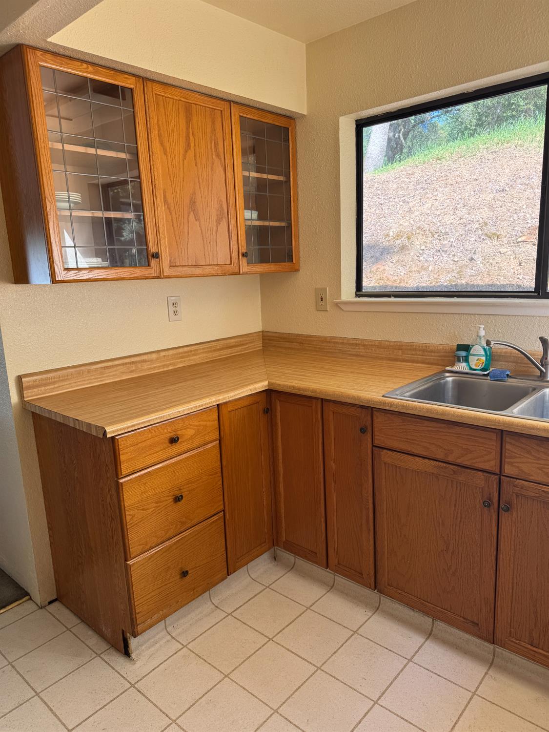 670 Stone House Road Auburn, CA 95603 - Photo 16 of 46 a kitchen with a cabinets and window